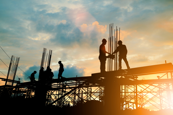 men in hardhats working on commercial construction project